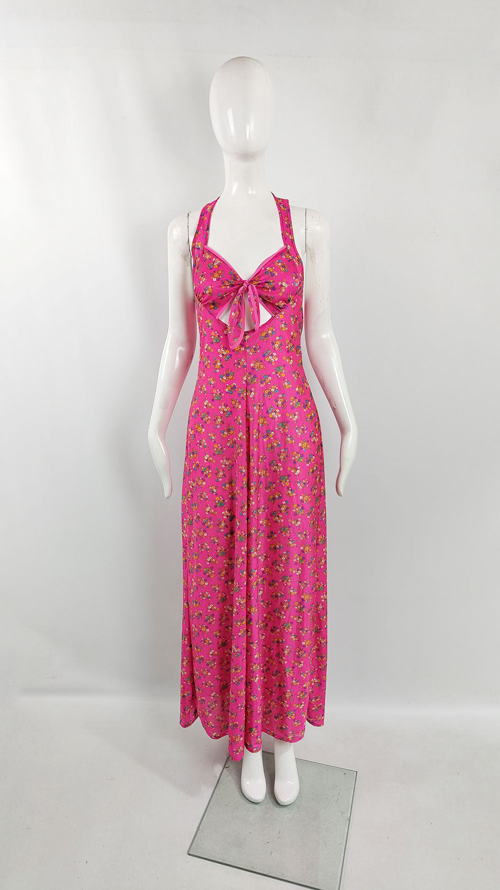An image of a mannequin wearing a vintage maxi dress from the 70s  by Van Allan.