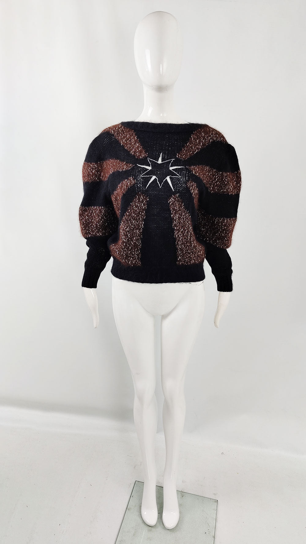 A mannequin wearing a vintage Thierry Mugler jumper in a black and brown angora wool with a star on the centre of the chest.