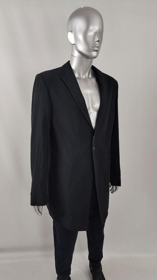 An image of a black wool blend vintage Carlo Pignatelli black tie long jacket.
