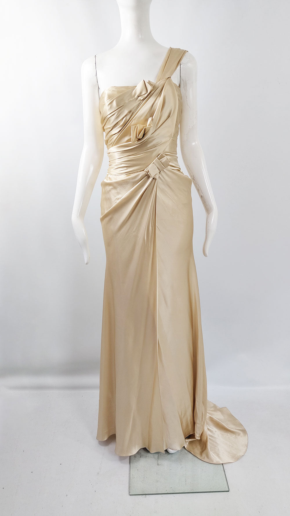 A one shoulder bridal dress by David Fielden made from 100% silk with pleated front and a long train.