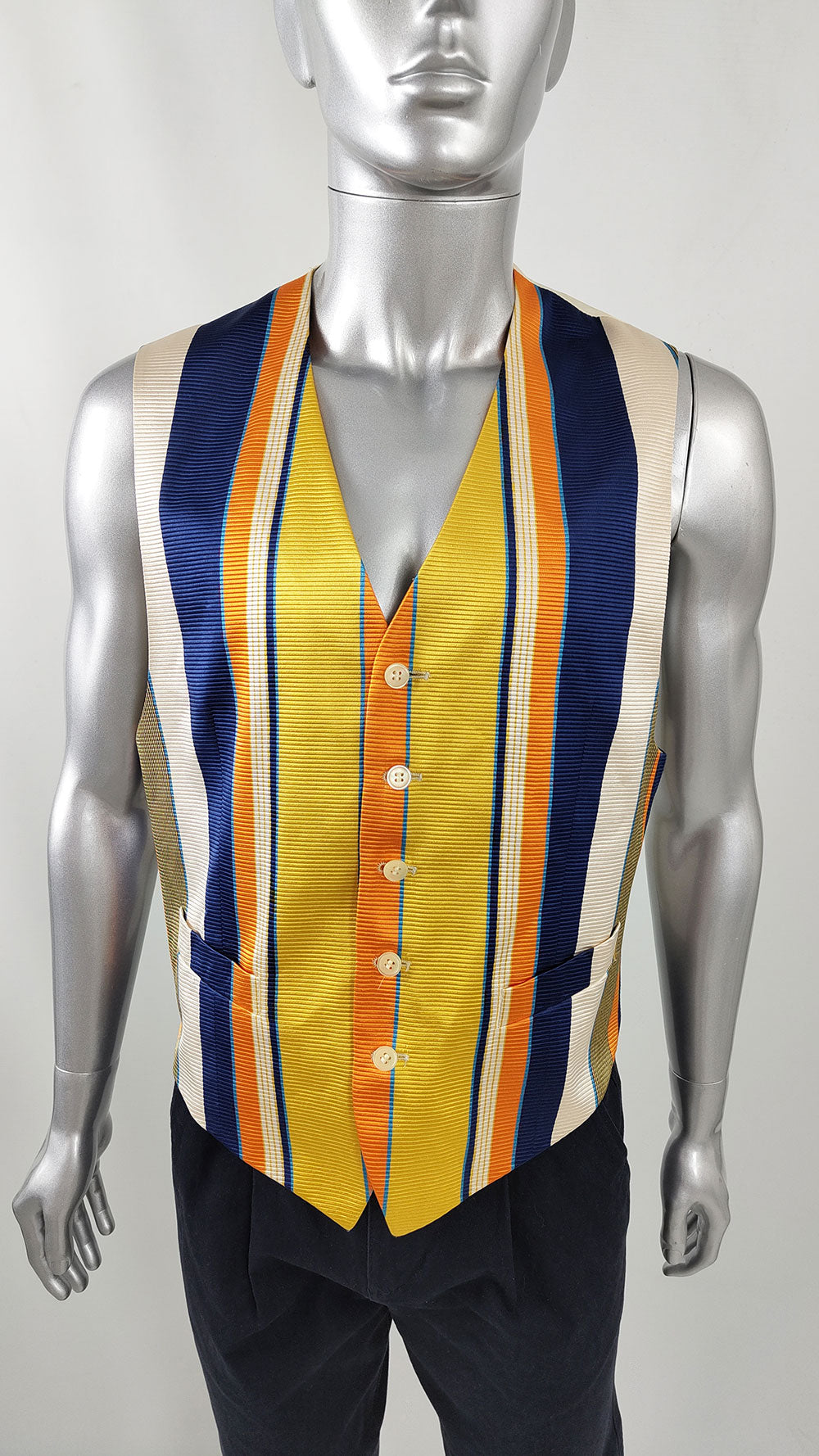 A mannequin wearing a vintage mens Kenzo silk waistcoat from the 1990s