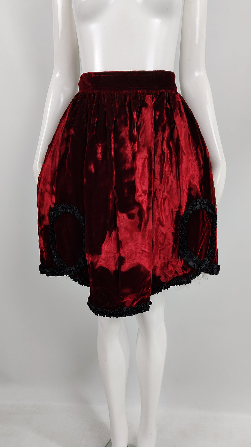 A vintage Helen Storey gathered skirt from the 1980s with a black ribbon trimming the deep red crushed velvet fabric.