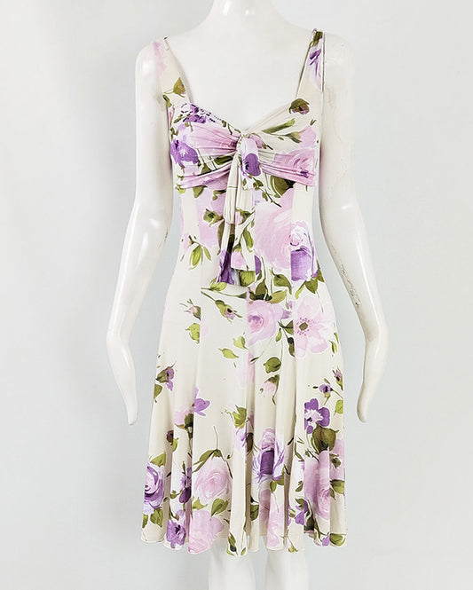 An image of a vintage Blumarine dress from the 2000s in a cream rayon with a purple floral print, perfect for a wedding guest.