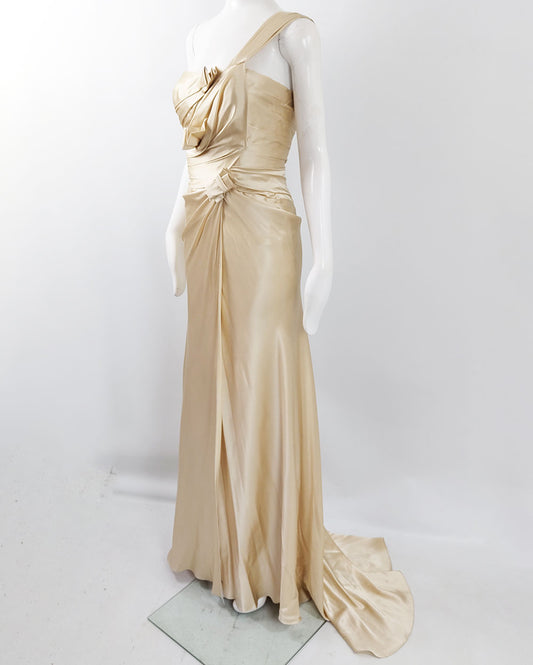 A vintage floor length gold silk wedding dress from the 90s by David Fielden with a train.