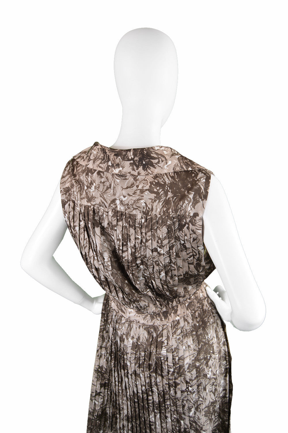 designer vintage frank usher dress with pleats on the back and the skirt from the 60s.