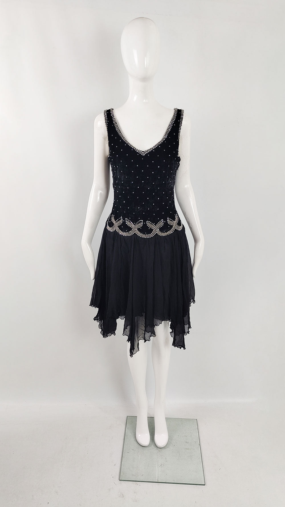 An image of a vintage Blumarine dress in a 1920s style with a beaded bodice and handkerchief hem.
