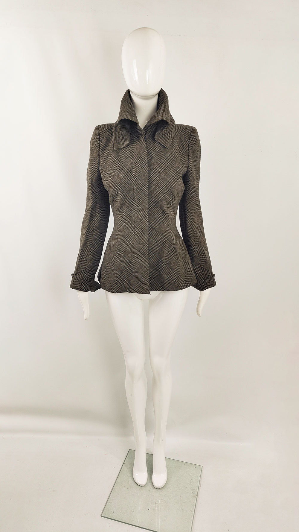 An image of a mannequin wearing a vintage tweed jacket for women by Parisian designer, Mariot Chanet.