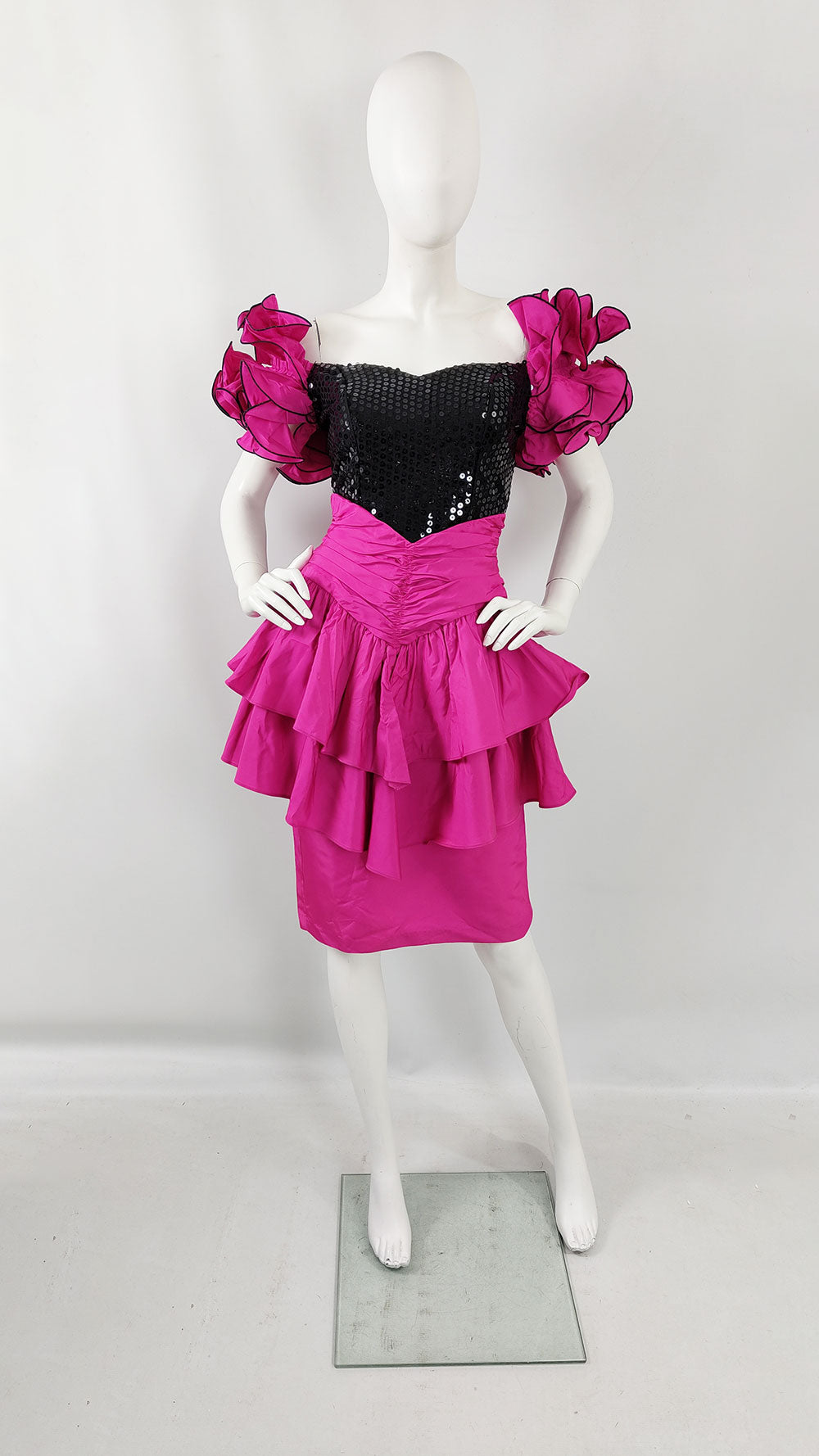 A black sequinned and pink taffeta vintage 80s prom dress.