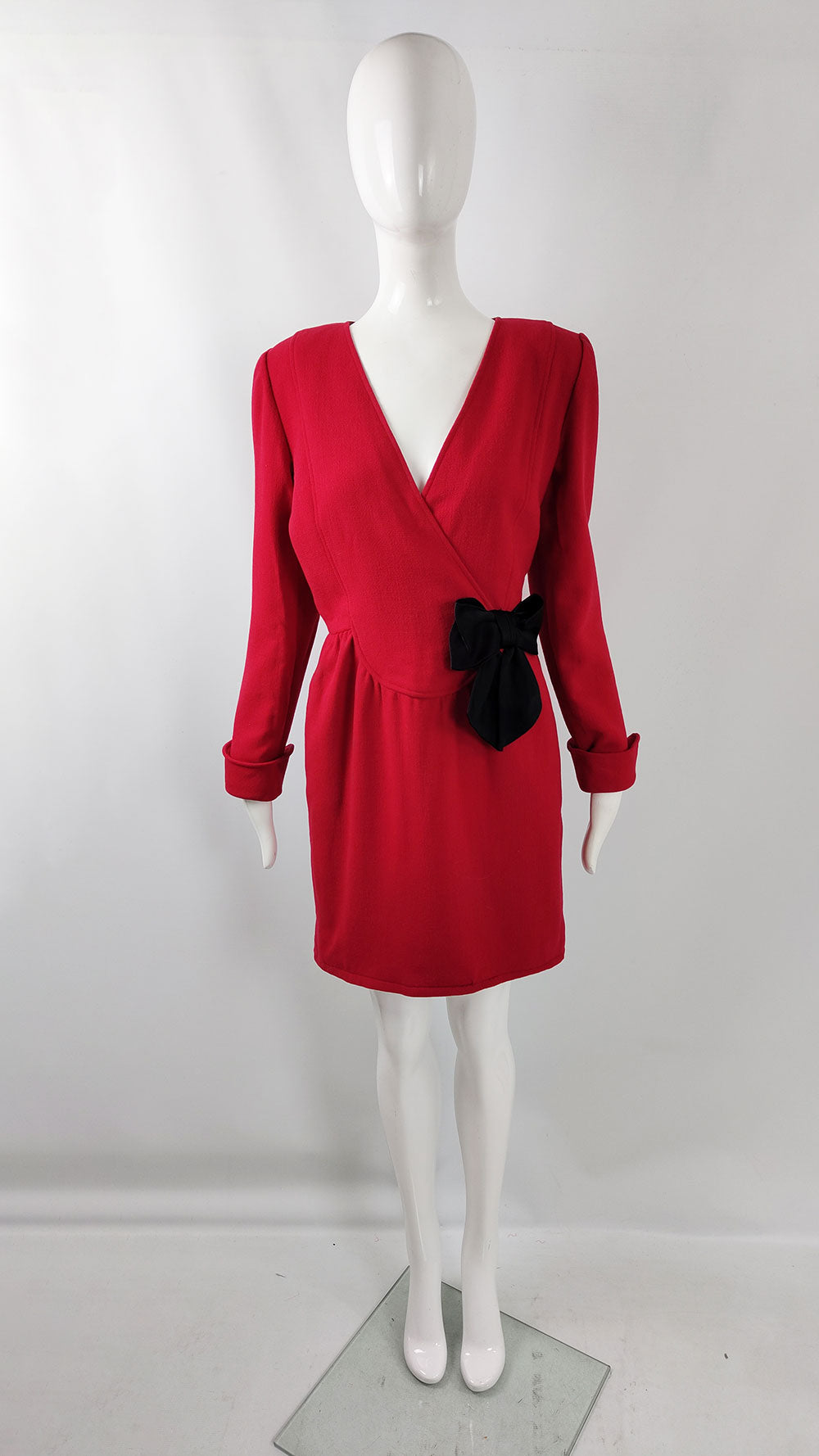 An image of a vintage Oscar de la Renta dress in a deep red crepe fabric.