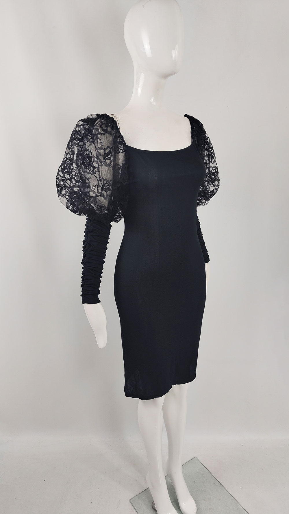 A fabulous vintage party dress from the 1980s by Roots of London with black lace leg o mutton sleeves.