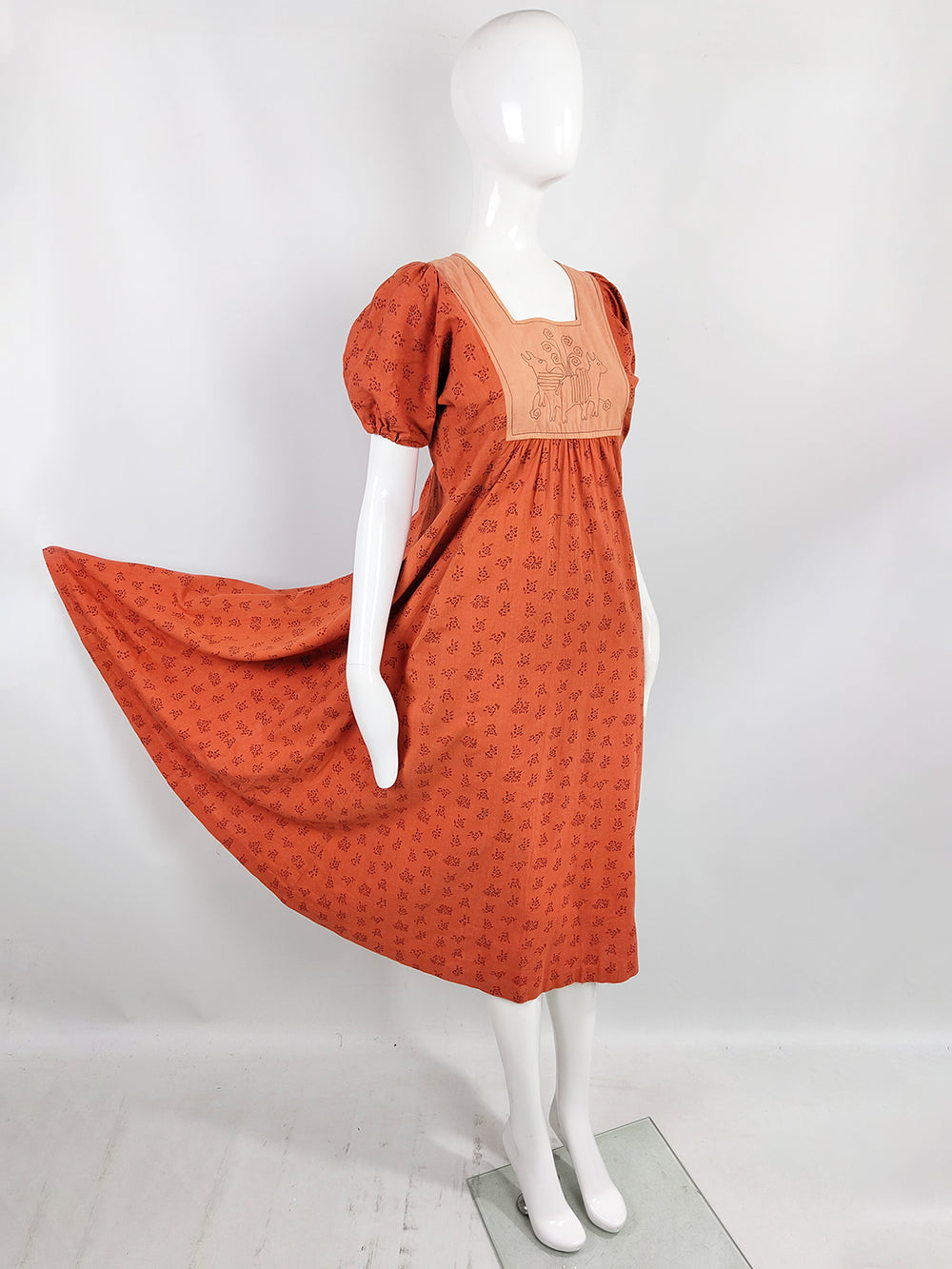 A 1970s vintage Indian Cotton Block print tent dress in a block print cotton with an embroidered top.