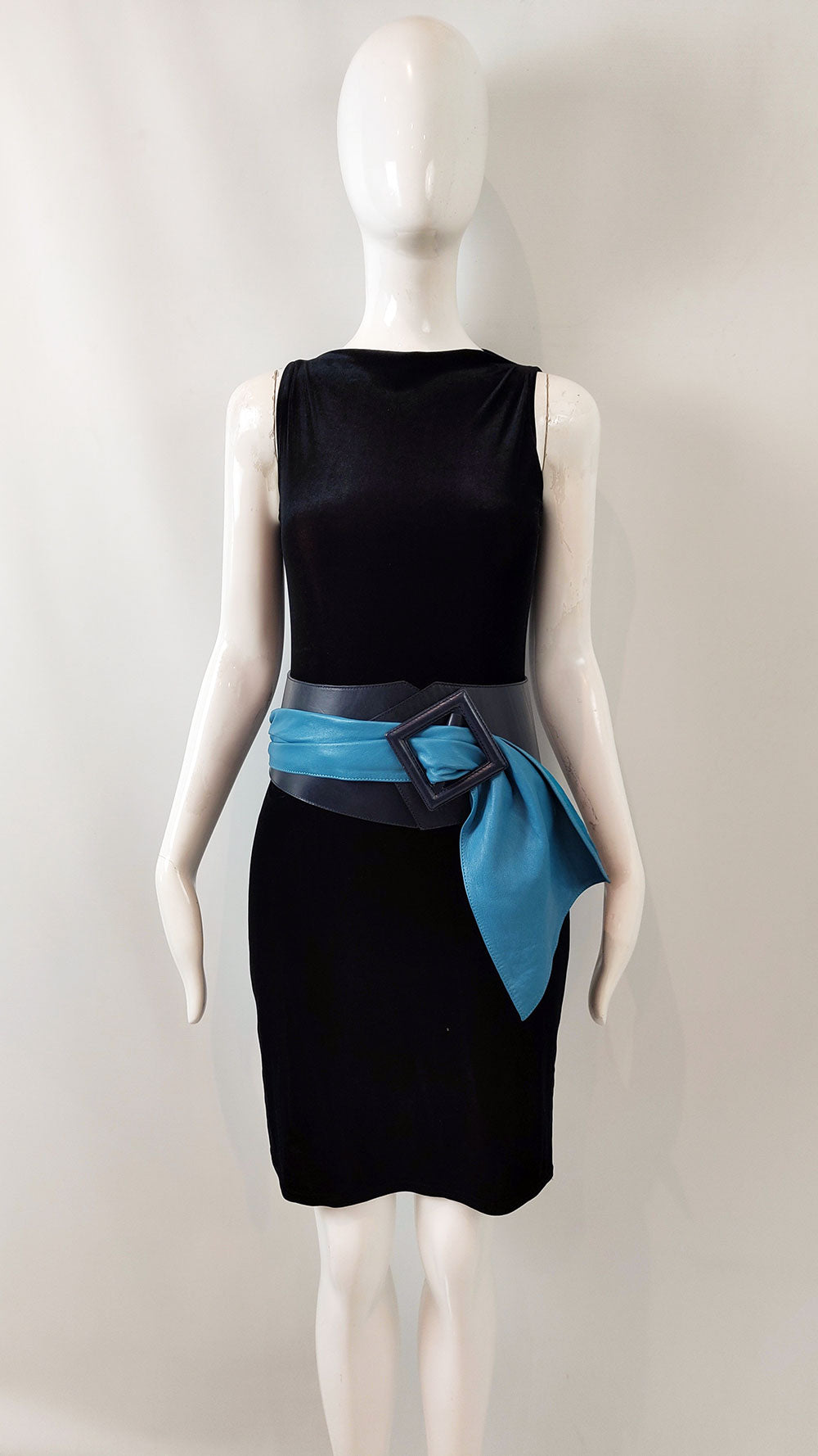 An image of a navy blue leather and turquoise leather belt from the 1980s
