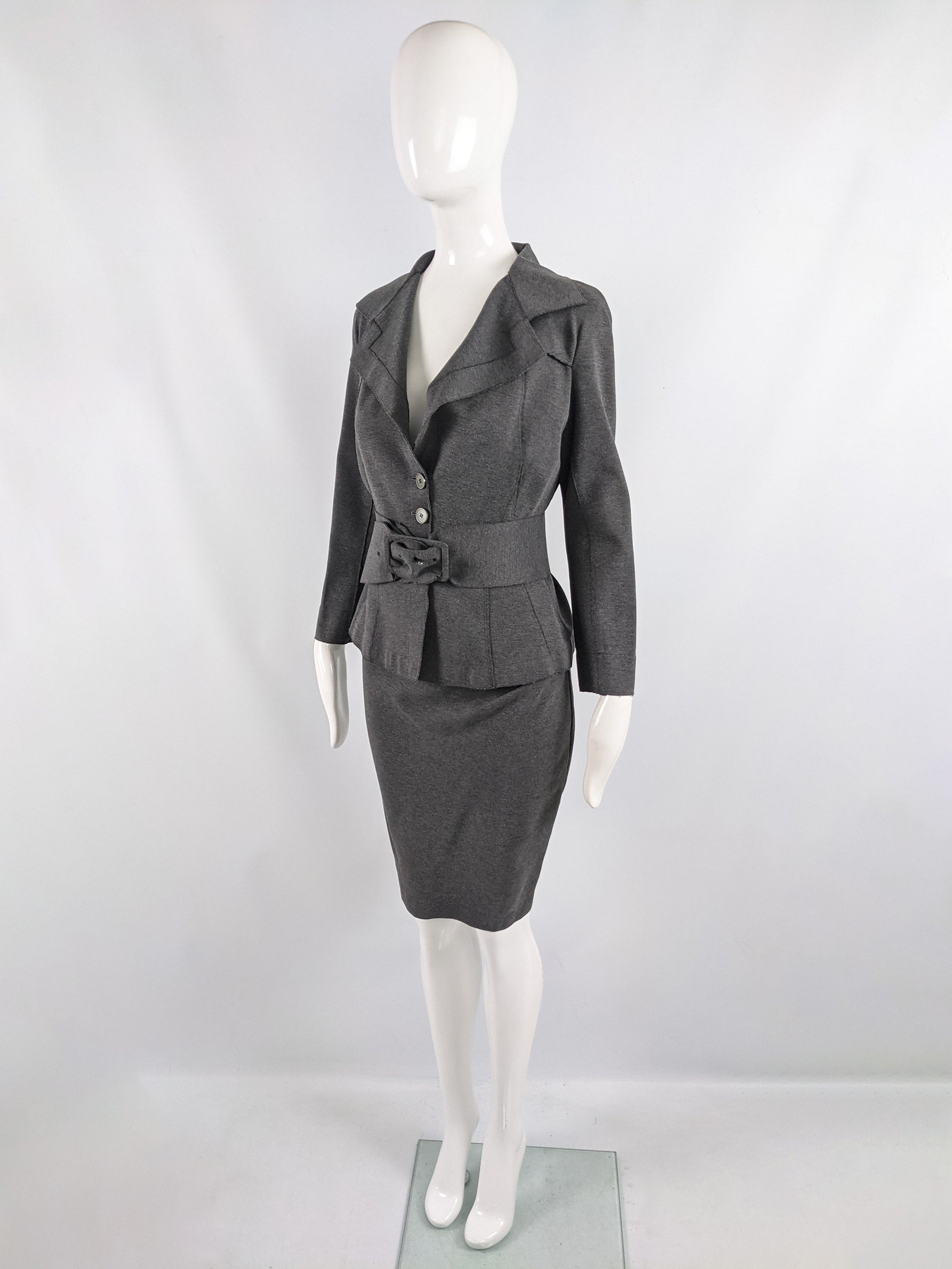 An image of a grey vintage Donna Karan suit for women, consisting of a pencil skirt, blazer and belt.