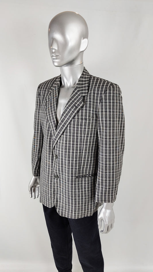 A mannequin wearing a black and grey mens vintage checked blazer for sale from Zeus Vintage.