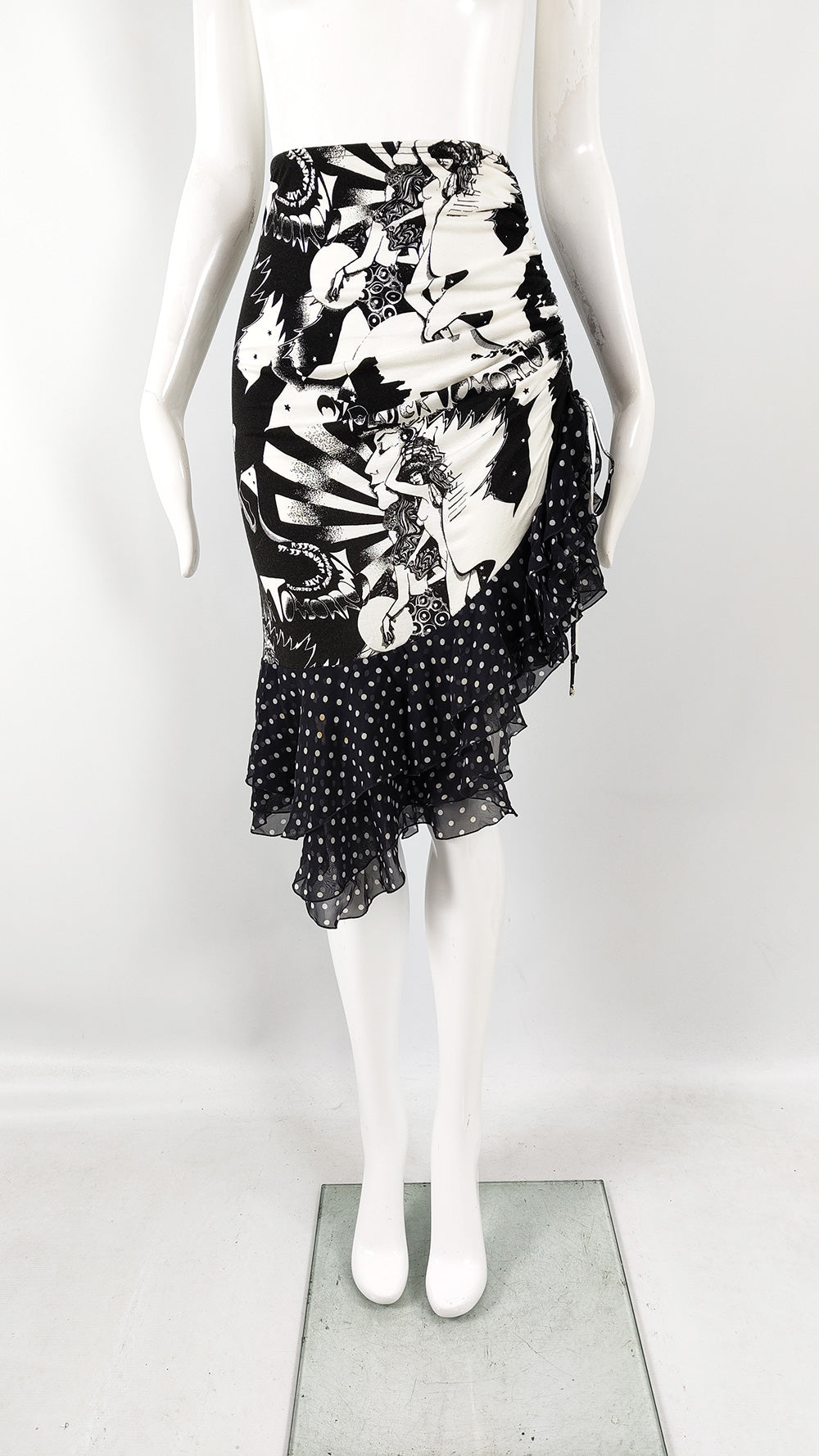 An Emanuel Ungaro vintage black and white rockstar print ruched skirt with polka dot silk chiffon ruffled trim. 