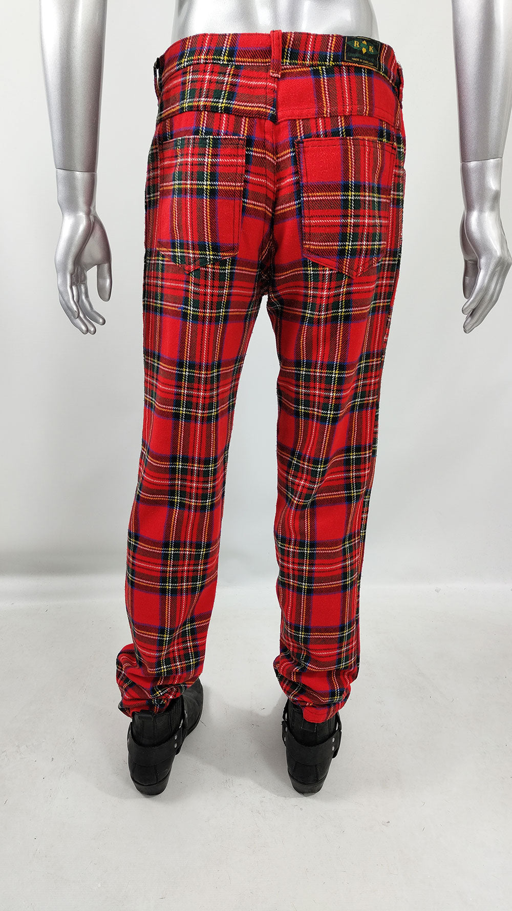 A vintage pair of red and green checked mens punk trousers from the 1980s.