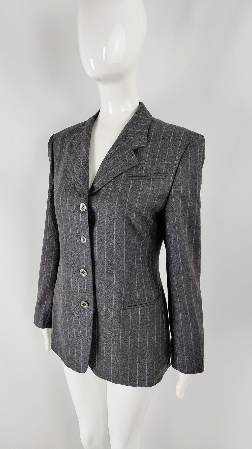An image of a grey pinstripe wool blazer with 4 buttons down the front by Claudio Lugli.