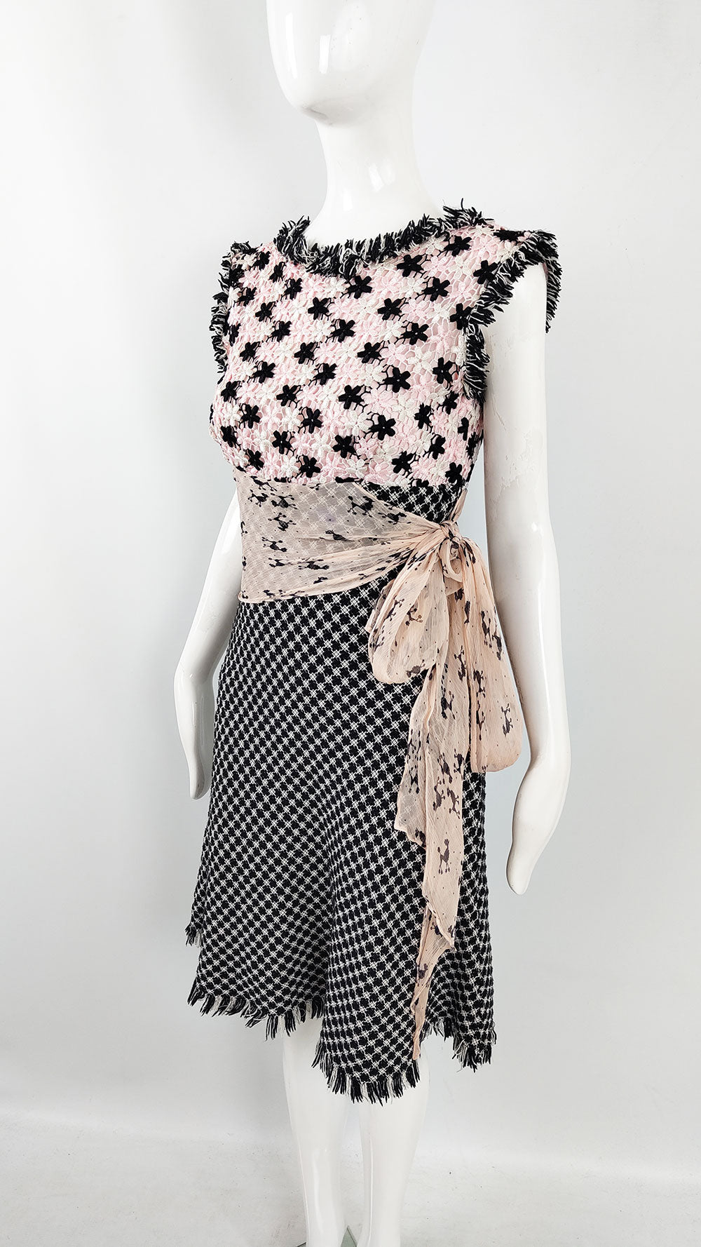 A preppy vintage womens dress from the early 2000s by Ronit Zilkha in a pink, white and black tweed.