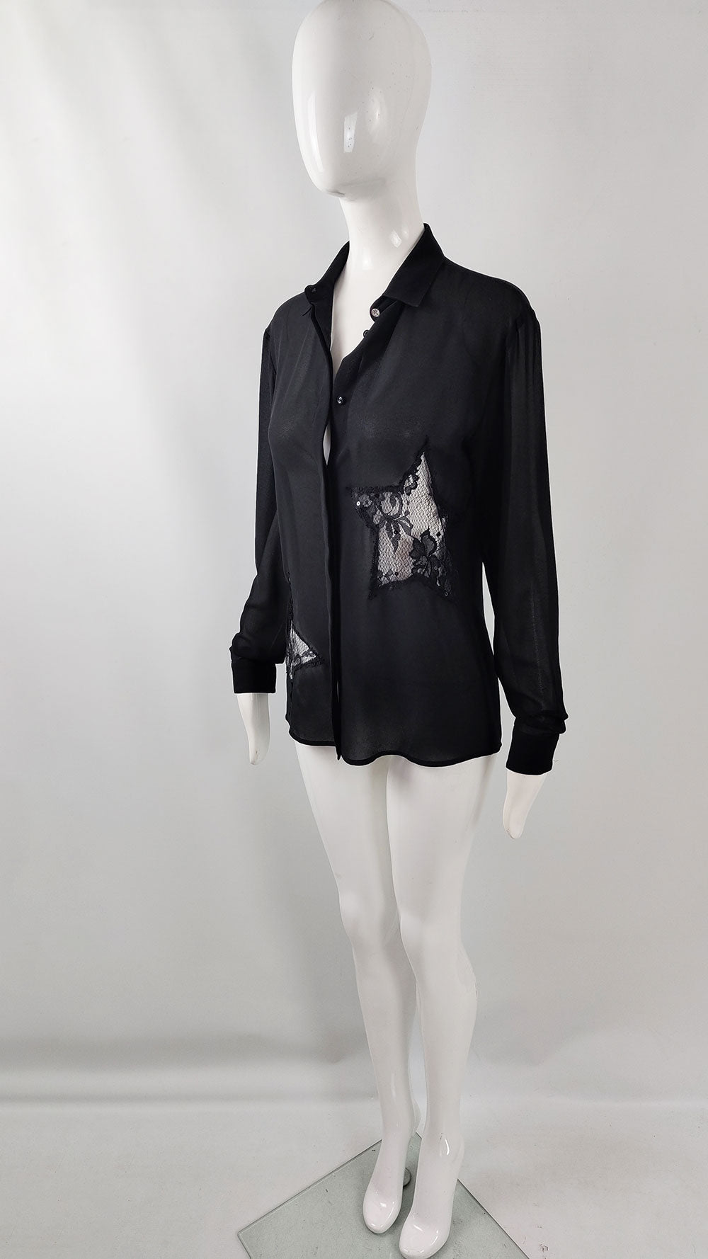 A vintage 2000s Blumarine Blugirl blouse with long sleeves and lace star cut out at the sides. 
