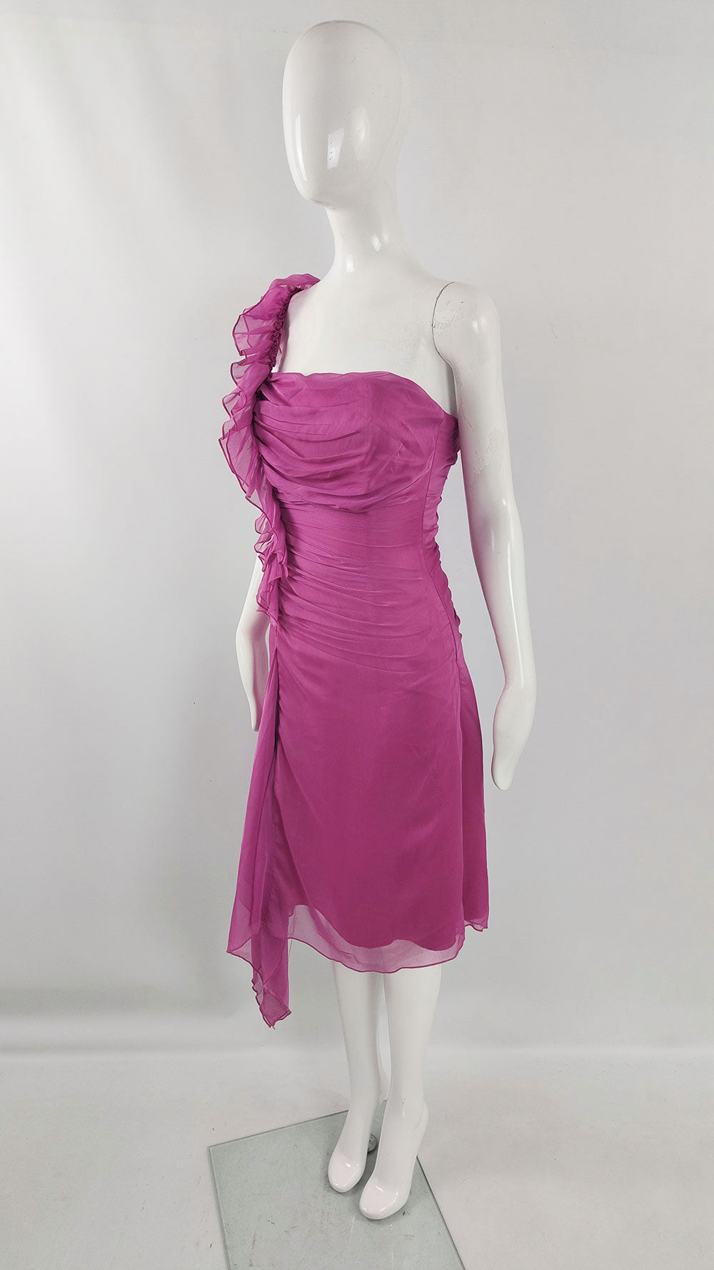 A fuchsia pink chiffon 2000s vintage party dress with ruffles on one shoulder