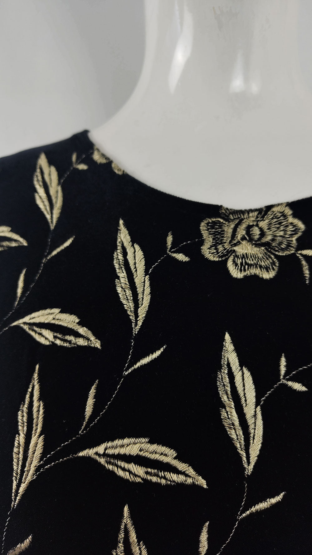 Close up of Embroidery on a vintage velour bodysuit from the 2000s.