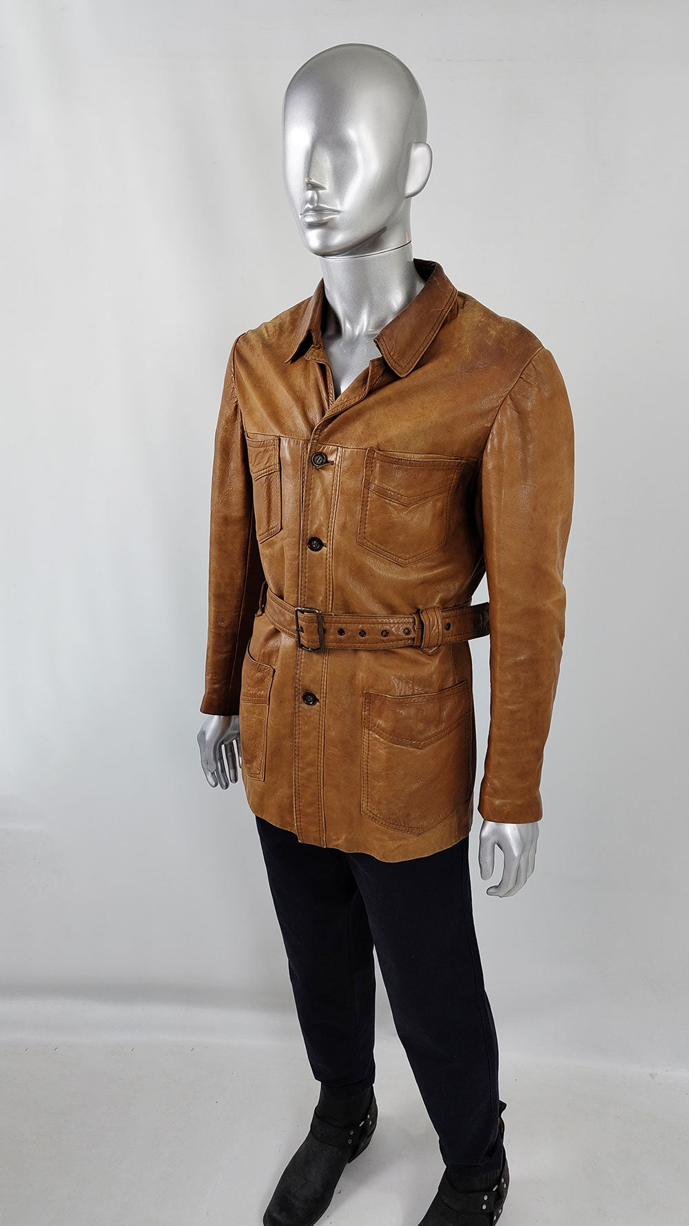 are and collectible vintage leather jacket with a matching belt and patch pockets by Hornes.