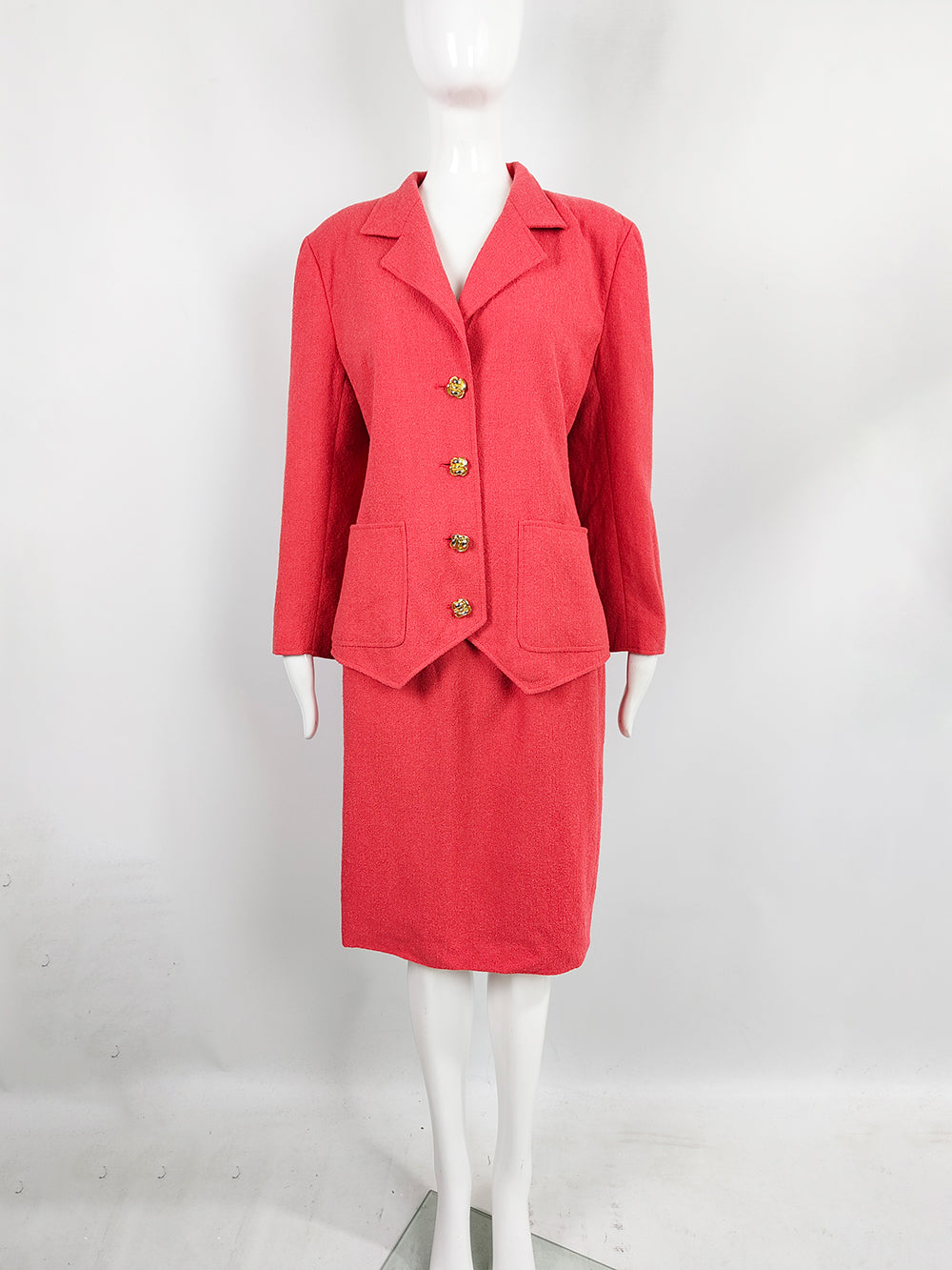 A vintage Valentino coral pink boucle tweed skirt suit from the 1980s. 