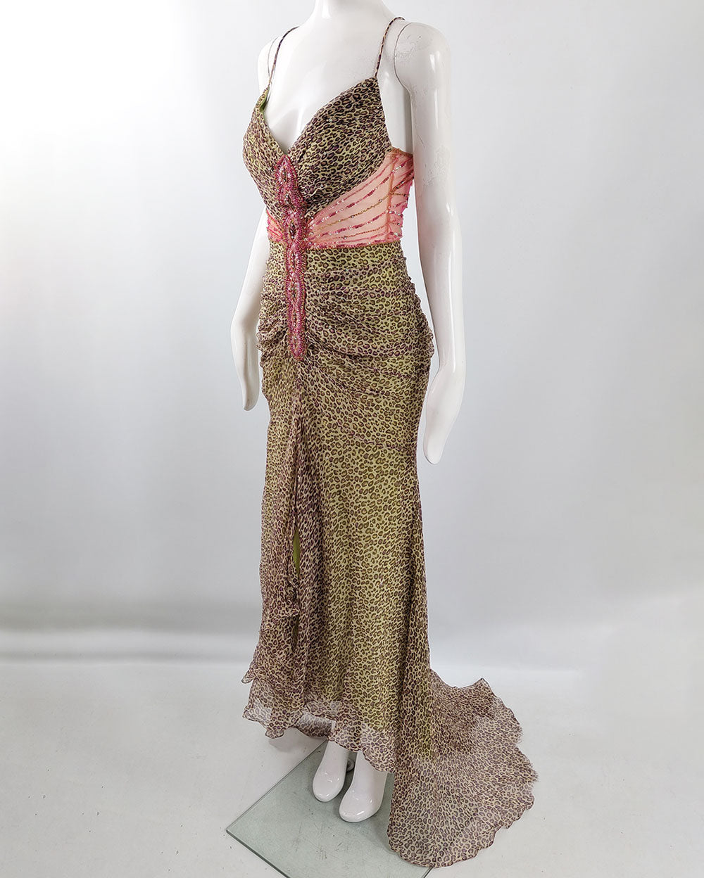 A vintage y2k sagaie paris dress in a green leopard print silk chiffon with pink  beaded mesh cut out at the waist.
