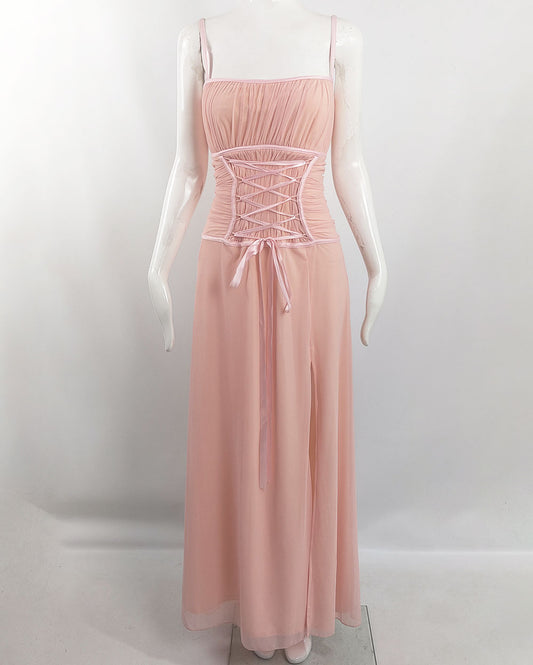 An image of a vintage 1990s tadashi shoji dress in a pink mesh fabric with a corset ribbon detail.